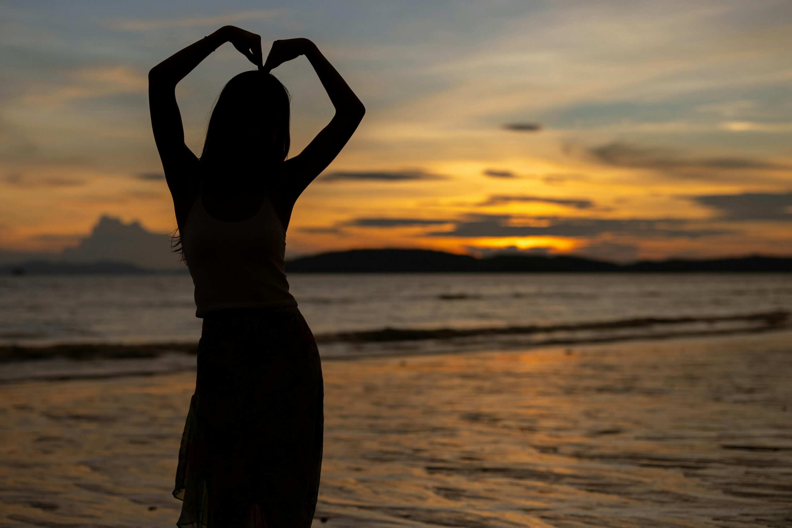 A serene woman embracing herself, symbolizing self-love and inner peace. Being free and loving herself authentically.