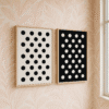 Pastel Elegance with Polka Dots Framed minimalist polka dot wall art set in black and white, displayed in a modern interior